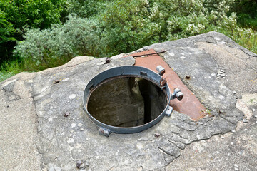 Open hatch for descending into the bunker of the German coastal anti-aircraft battery 