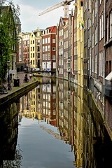 Building reflections in a canal in Amsterdam 