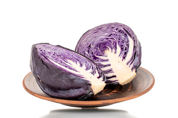 Two halves of fresh red cabbage on a ceramic plate, close-up, isolated on white. - Powered by Adobe
