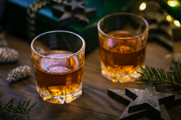 Whiskey, brandy or liquor shot and Christmas decorations