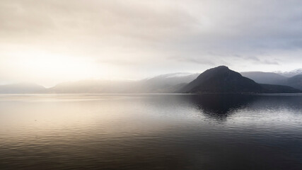 Fototapeta na wymiar Norway Fjords snowy landscape during the day light.