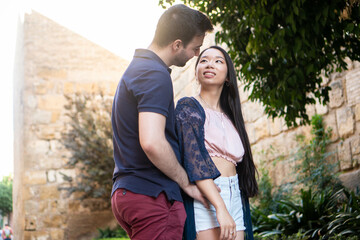 Lovers in a date. Real interracial young couple in love.