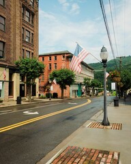 Fototapeta na wymiar Street and American flags in downtown Hinton, West Virginia