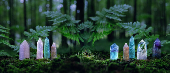 quartz Gemstones on mysterious forest natural background. minerals for esoteric Magic crystal...