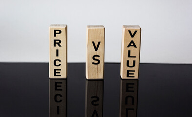Wooden blocks with Price vs Value inscription on black and white background