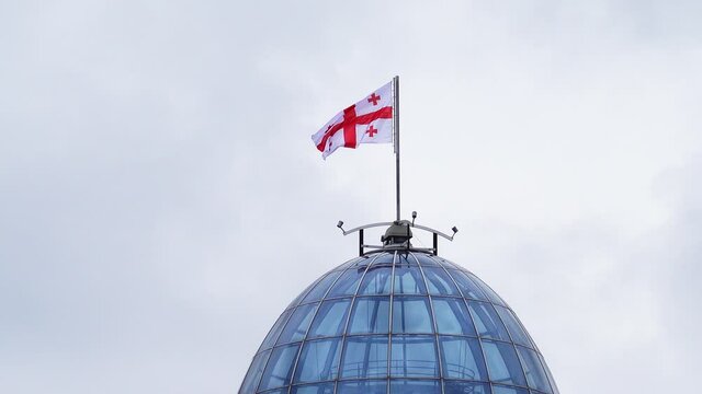 Modern palace with flag of Georgia