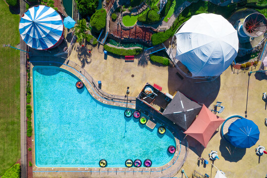 Pool. Summer or spring break vacation. Swimming pool season is opened. Outdoor water park for swim, relax. Florida hotel and resort. Top view. Aerial drone photography.