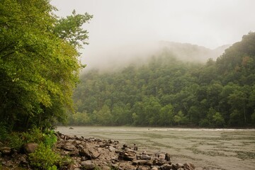 A foggy morning on the New River, at Sandstone Falls in New River Gorge National Park, West Virginia