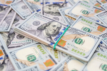 Stack of one hundred dollar bills