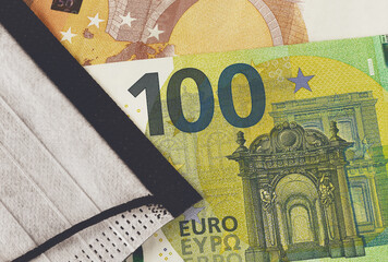 Face mask on Euro banknotes bill background