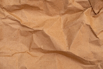 Crumpled beige paper texture. Paper background for design