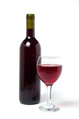 A glass of red wine and a bottle of wine on a white background. Alcoholic drink.