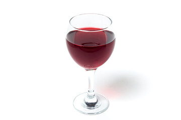 Glass of red wine on a white background. Alcoholic drink.