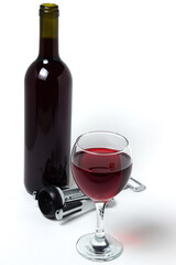 A glass of red wine and a bottle of wine on a white background. Alcoholic drink.
