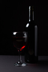 Three glasses of red wine on a black background. Alcoholic drink.