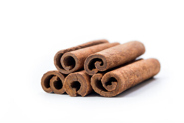 Stack of cinnamon sticks isolated on white background, clipping path included