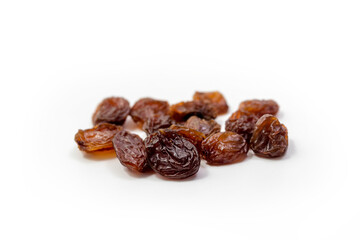 Raisins on white background, dried seedless grapes. Isolated Raisin