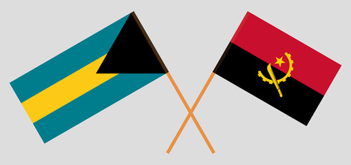 Crossed flags of the Bahamas and Angola. Official colors. Correct proportion