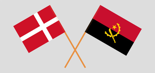 Crossed flags of Denmark and Angola. Official colors. Correct proportion