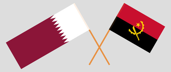 Crossed flags of Qatar and Angola. Official colors. Correct proportion