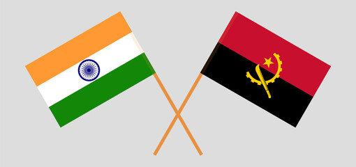 Crossed flags of India and Angola. Official colors. Correct proportion