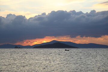 sunset on the beach. Seaside town of Turgutreis and spectacular sunsets