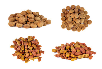 Top view of brown crunchy organic kibble pieces for cat and dog feed heap set isolated on white background. Healthy dry pet food.