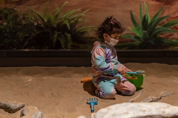 Child archaeologist excavating for dinosaur fossil