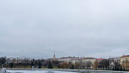 Dark waters of the river with thin plates of ice. The first ice on the river in center of Minsk.