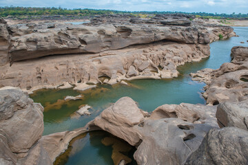 Colorful rocks, puddles and strange shaped rocks in the Mekong River