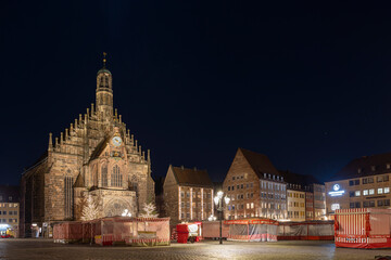 Fototapeta na wymiar Medieval buildings illuminated in winter night in Nuremberg