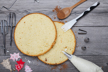 cake layers and cream on the kitchen table. View from above.