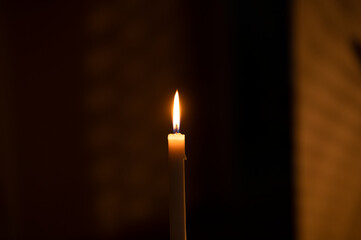 Christmas light. Candle. Dark. Light photo. 