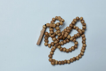 Prayer beads made of wood white background	
