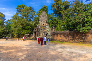 Ruins of Ta Prohm temple in Angkor complex, overgrown by trees, Cambodia