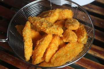 Freshly ripe fried bananas with a brown color made with bananas dipped in a mixture of liquid flour and breadcrumbs