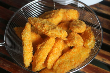 Freshly ripe fried bananas with a brown color made with bananas dipped in a mixture of liquid flour and breadcrumbs