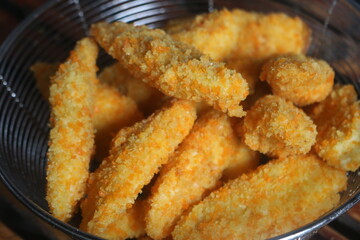 Freshly ripe fried bananas with a brown color made with bananas dipped in a mixture of liquid flour and breadcrumbs