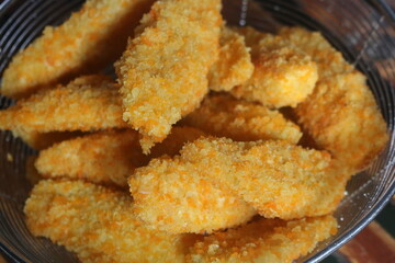 Freshly ripe fried bananas with a brown color made with bananas dipped in a mixture of liquid flour and breadcrumbs