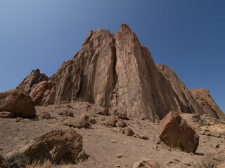 Close Up of Shiprock Mountain with Large Boulders Scattered in the Foreground