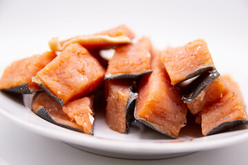 Sliced delicious salted fish on a plate with a blurred background