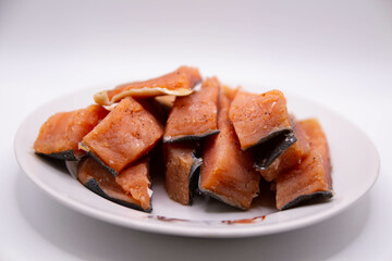 Sliced delicious salted fish on a plate with a blurred background