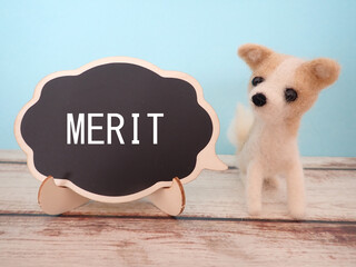 MERITメリットの単語と羊毛フェルトの子犬