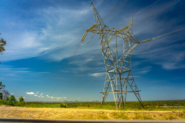 Australian electricity pole with Glass House mountains in the background