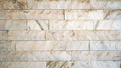 白い長方形の石が積み上げられた模様の建物の壁