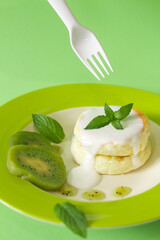 Menu pancake kiwi on green background