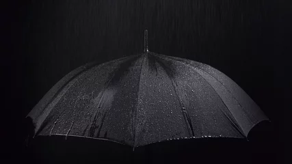 Fotobehang Photo of the black umbrella and rainy drops on black background © Chris Tefme
