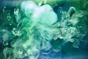 Blue green smoke on black ink background, colorful fog, abstract swirling ocean sea, acrylic paint pigment underwater © amixstudio