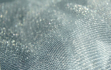 Texture of blue fatin. Colored background with tulle fabric close up
