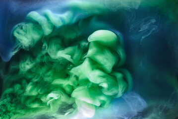 Blue green smoke on black ink background, colorful fog, abstract swirling ocean sea, acrylic paint pigment underwater © amixstudio
